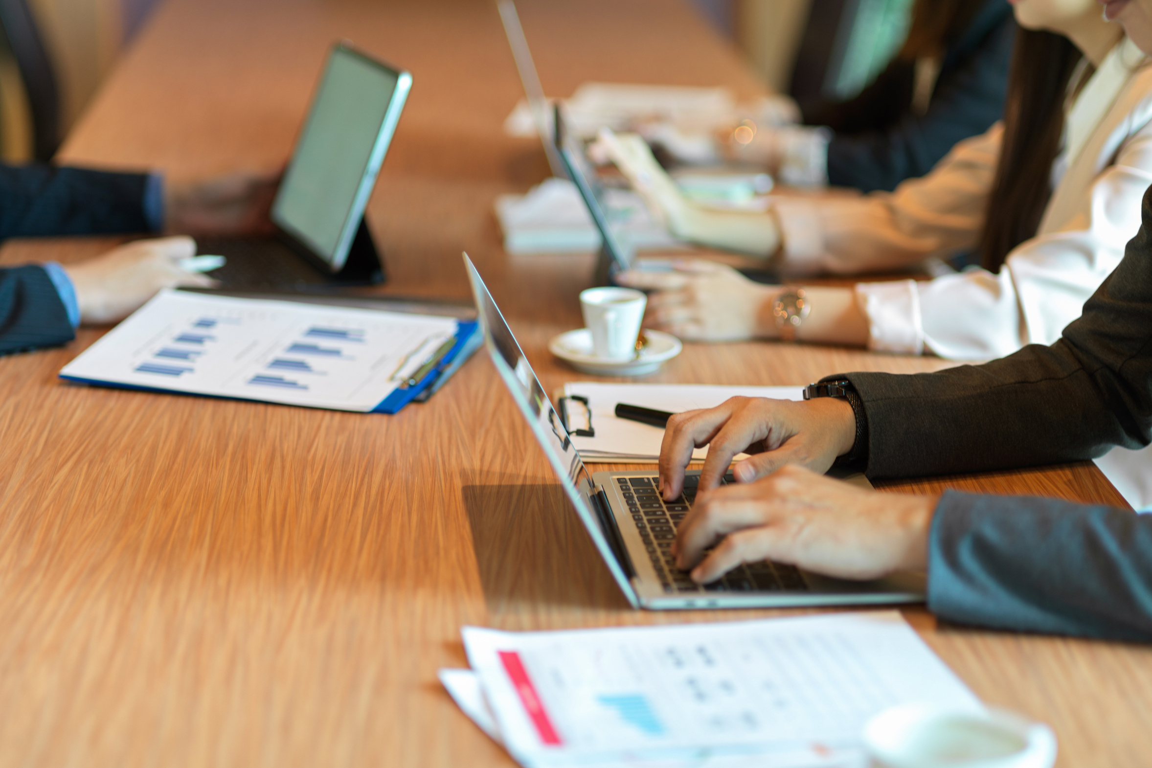 Business board members meeting with business owner in board room